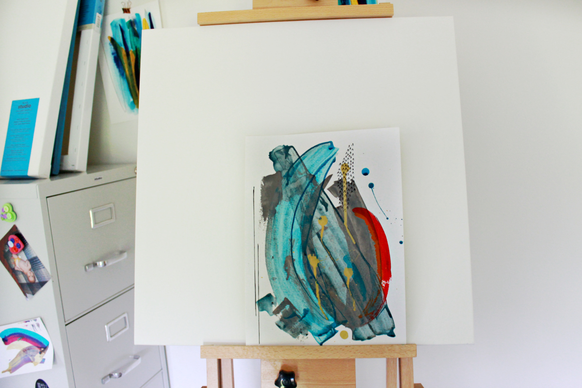 turquoise and red abstract on easel