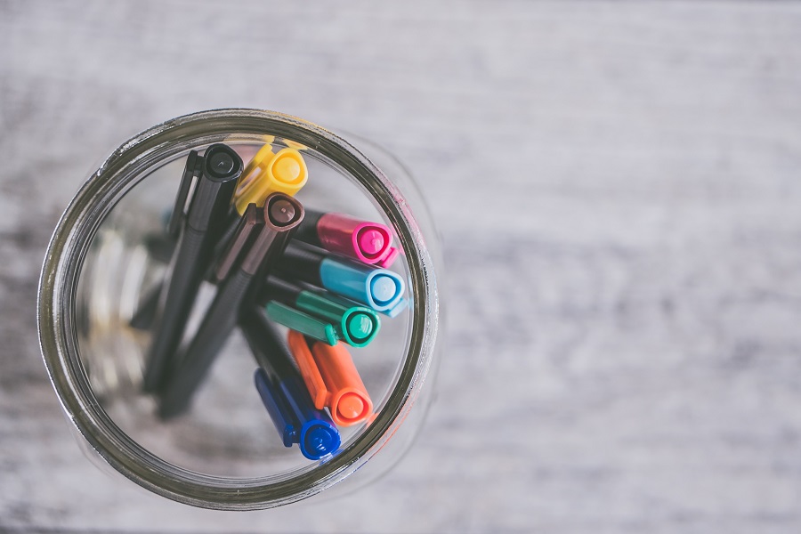 creative goals at desk with pens