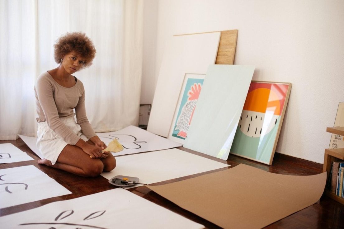 female artist on art studio floor