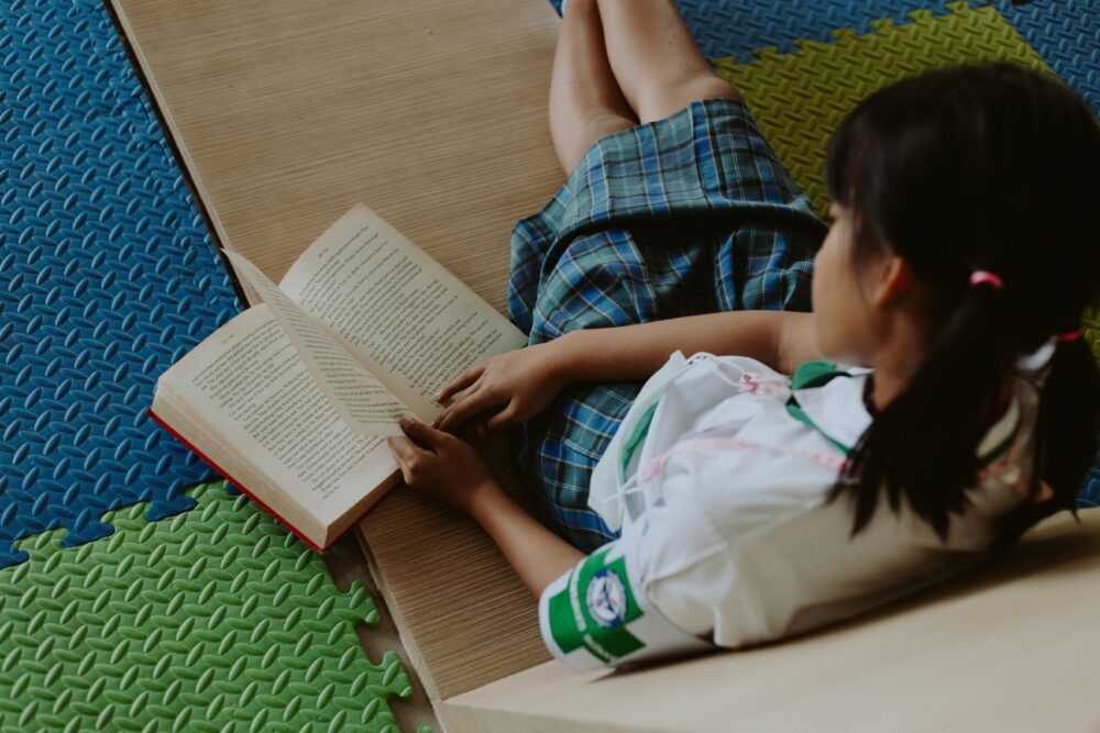 young girl reading book